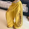Pantalones deportivos negros estilo americano con estampado de leopardo y letras, pantalones de jazz para mujer, pantalones deportivos casuales holgados de pierna ancha curva