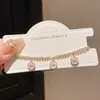 Pulseira Banhada a Ouro Real 18K Estilo Levemente Luxuoso Fecho Redondo Olho de Zircônia Madrepérola Pulseira Exquisita de Alta Qualidade Europeia e Americana para Mulheres