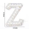 Venta caliente transfronteriza de 26 pegatinas de tela con forma de estrella de cinco puntas y letras de perla para ropa, sombreros y bolsos, materiales decorativos.