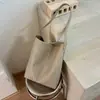 Bolso de mujer de gran capacidad, nuevo y moderno de 2026, popular de verano, bolso de hombro de patrón tejido de alta gama, bolso tote para el trabajo