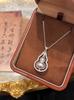 Colar com Pingente de Abóbora de Diamante Banhado a Ouro Rotativo para Mulheres, Acessório com Pingente de Design de Nicho de Luxo Leve e Sofisticado, Corrente para Clavícula