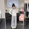 Conjunto de dos piezas de moda coreana estilo universitario, personalidad moderna, cuello polo, sudadera, pantalones casuales de pierna ancha a cuadros para niñas en primavera y otoño