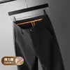 Pantalones casuales elásticos de exportación de comercio exterior para hombre, nuevos pantalones de traje de negocios rectos de ajuste holgado para hombre de mediana edad para otoño e invierno 2026