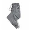 Pantalones deportivos para hombre Primavera Nuevo talla grande holgados pantalones de chándal tobilleros tejido de punto moda moderno cremallera camuflaje pantalones casuales