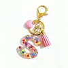 Llavero de Resina Rosa con Lentejuelas y Letras de Alta Venta Transfronteriza, Accesorio Colgante para Bolso con Borla en Forma de Corazón