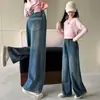 Pantalones de invierno para niñas 2026 estilo coreano versátiles de mezclilla bordados forrados de polar hasta el suelo para niños medianos y grandes otoño pierna recta pierna ancha al por mayor