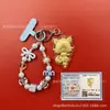 Llavero de tela con logo de empresa personalizado Cadena para teléfono móvil Angela Lámina de oro puro Oro 999 Regalo de aniversario