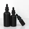 Venta al por mayor del fabricante Botella gotero de vidrio negro mate portátil de 10 ml Botella de aceite esencial 30 ml Botella vacía rellenable a prueba de luz para muestras cosméticas