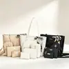 Bolso bandolera para teléfono de mujer 2026, nuevo estilo casual transfronterizo, bolso tote con patrón de ondas en relieve, bolso de hombro cuadrado pequeño