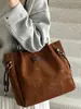 Bolsa de mano casual Shuai Mijia para mujer, gran capacidad, nueva moda 2026, bolso de hombro, bolso de mano casual para el trabajo con textura