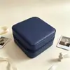 Popular en Europa y América, joyero compacto y portátil, caja de almacenamiento de accesorios de cuero, bolsa de almacenamiento antioxidante para pendientes, colgantes y anillos