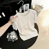 Camiseta de punto de seda helada hueca de manga corta, cuello redondo, holgada, adelgazante, para mujer, verano 2026, fina, tacto de alta gama