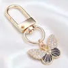 Llavero de Mariposa de Esmalte Blanco y Negro de Gama Alta, Colgante Completo de Diamante, Mariposa Combinada con Colgante de Oro, Llavero DIY, Colgante Pequeño