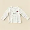 Outono 2026 Infantil Estilo Coreano Manga Longa Camada Base Gola Redonda Laço 3D Gato Bordado Estampado Completo Estrelas Top
