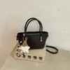 Elegante bolsa de dumplings tejida para mujer, nueva moda otoño 2026, bolso cruzado pequeño versátil para el día a día