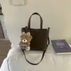 Bolsa Balde de Mão com Design de Nicho Estilo Coreano para Mulheres Nova Moda Primavera 2026 Bolsa de Ombro Transversal Simples e Elegante