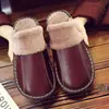 Pantuflas de piel de vaca Haining para hombre y mujer otoño e invierno amantes antideslizantes hogar interior suelo cálido cuero algodón pantuflas al por mayor