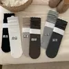 Meias com padrão oculto de renda estilo outono e inverno feminino meias de algodão puro de cano médio meias longas folgadas da moda estilo japonês com renda com Birkenstocks