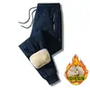 Pantalones de algodón transfronterizos de lana de cordero para otoño e invierno, forrados de polar, a prueba de frío, pantalones casuales elásticos en la cintura para hombre, pantalones largos cálidos y aislantes