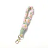 Nueva Cadena de Muñeca Tejida a Mano Estilo Pastoral Cordón Flor Pequeña Margarita Flor Roja Pequeña Accesorios Colgantes Versátiles para Ropa