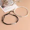 Joia para casal europeu e americano popular pulseira da sorte trançada à mão pulseira ajustável preto e branco joia
