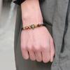 Explosiones de Amazon cabeza de animal accesorios de cobre negro esmerilado pulsera de ojo de tigre de cuero ventas directas de fábrica