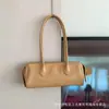 Bolso de Hombro tipo Baguette de Cuero de Vaca de Diseño de Nicho para Mujer 2026 Nuevo Modelo de Alta Calidad Simple Versátil Bolso de Mano de Cuero Genuino