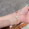 Versión Alta Pulsera de Trébol de Cuatro Hojas Explosivo Rosa con Incrustaciones de Diamantes Concha Blanca Microincrustada de Diamantes Completa Exquisita Pulsera de Lujo Ligero de Alta Gama para Mujer
