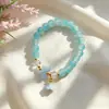 Nuevo Colgante de Lirio del Valle Pulsera de Cuentas de Vidrio para Mujer Verano Diseño de Nicho Accesorios Culturales Creativos Punto Turístico del Templo Venta Caliente al por Mayor