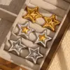 Moda europea y americana temperamento diseño nicho alta sensación pendientes acero inoxidable chapado oro 18K nuevos pendientes doble estrella de cinco puntas