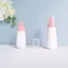 En stock botella cónica blanca de espuma de 60 ml, botella espumadora de PET para mousse de 100 ml, dispensador portátil de espuma facial