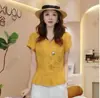 Popular Blusa de Manga Corta Plisada con Cuello en V Estilo Francés Ajustada a la Cintura Moda Verano 2026 Chic Color Sólido
