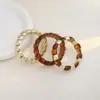 Conjunto europeo y americano de tres piezas de cordón elástico cuadrado geométrico acrílico pulsera étnica vintage de alta gama moda
