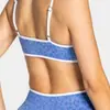 Soporta procesamiento OEM/ODM y personalización Conjunto deportivo de estampado de leopardo para mujer, sujetador y shorts, conjunto de ropa deportiva para exteriores y yoga