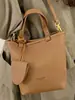 Bolsa de Ombro Feminina Casual de Nicho 2025 Nova Moda Tendência Bolsa Saco Simples Transversal Bolsa de Mão Bolsa Mãe-Filha Tendência