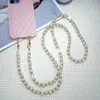 Correa de teléfono de perlas y diamantes para llevar cruzada, cadena de teléfono cruzada estilo diosa anti-pérdida, nueva correa de perlas de alta gama
