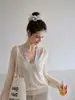 Suéter de punto para mujer, estilo francés, color avena suave, cuello en V, manga larga, nueva colección de otoño, con diseño calado, perfecto como capa exterior