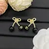 2025 Nuevo Modelo Huajia Versión de Alta Gama Pendientes en Forma de V con Diamantes Rojos Cereza para Mujer, Collar de Lazo de Lujo al por Mayor