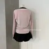 Ruoxin 26 Novo Conjunto de Duas Peças para o Início do Outono Estilo Coreano Casual com Blocos de Cor e Listras, Top Regata com Decote Halter + Saída de Praia Rosa