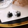 Pendientes elegantes de estilo francés con incrustaciones de diamantes y circonita negra hueca para mujer, ligeros, de lujo y de alta gama.