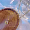 Nueva cadena de clavícula de lujo estilo coreano, collar versátil de acero de titanio de moda para mujer, colgante simple clásico de circón, accesorio versátil