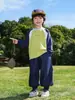 Camiseta de Manga Larga para Niños 2026 Primavera Nuevo Color Bloqueado Raglán Estilo Montaña Camping al Aire Libre Algodón Puro para Niños Versátil