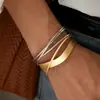 Pulsera Abierta Geométrica de Capas Cruzadas con Brillo Metálico Europea y Americana con un Toque Único Minimalista de Nicho de Alta Gama, Joyería Transfronteriza