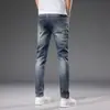 Dropshipping de Roupas Masculinas Xintang 2026 Estilo Coreano Slim Fit Stretch Versátil Verão Jeans Masculino Fino