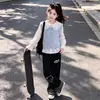 Conjunto casual versátil de moda para niñas estilo coreano, camisa chaleco dopamina otoño 2026, conjunto de capas