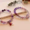 Pulsera elástica de cristal natural material de pozo antiguo temperamento coreano pulsera de cristal de fresa nueve fuegos púrpuras joyería al por mayor
