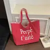 Nuevo bolso tote casual estilo coreano de Shuai Mi, bolso de mano de moda con estampado de letras, bolso de hombro a rayas de doble cara para mujer
