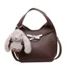 Bolso de mano de alta gama y elegante, nuevo bolso cruzado versátil de moda para mujer 2026, bolso tote tipo cubo pequeño de color liso