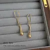 Pendientes minimalistas lisos con forma de gota de agua al por mayor diseño de nicho geométricos irregulares pendientes transfronterizos de alta gama para mujer