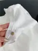 Camiseta de Manga Larga de Algodón de Bambú Delgada con Botón de Nácar para Mujer, Camiseta Básica Sencilla Casual de Color Sólido con Cuello Redondo, Principios de Primavera 2026